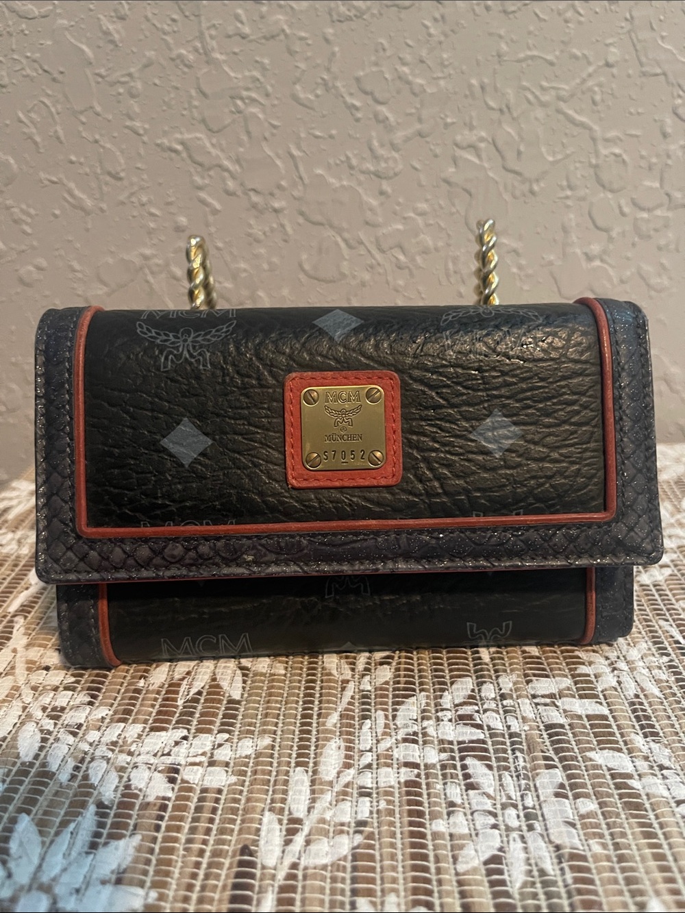 MCM Black Leather Trifold Wallet with Coral Trim and Gold Plaque